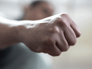 Close-up of a clenched fist suggesting aggressive intent