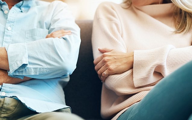 couple sitting arms crossed