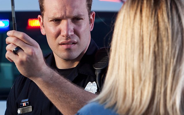 police officer performing dui test